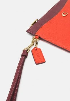 Brand new ???? Coach COLORBLOCK ZIP WRISTLET - Wallet - Red Orange Multi ???? -Coach Shop a6bc65147e0244a0a7eafa164d83f60d