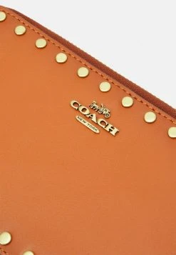 Deals ???? Coach SMOOTH WITH RIVETS KIRA CROSSBODY - Across Body Bag - Canyon ???? -Coach Shop c6da48c9c9254e8db163105c244231cc