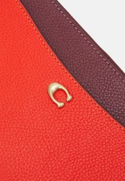 Brand new ???? Coach COLORBLOCK ZIP WRISTLET - Wallet - Red Orange Multi ???? -Coach Shop d91e8007b136496cb082861ce4cc604b