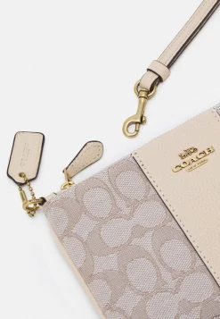 Outlet ???? Coach SIGNATURE SMALL WRISTLET - Wallet - Stone Ivory ???? -Coach Shop f0afa519e3cd42a2a6c0ed8fe319a43f